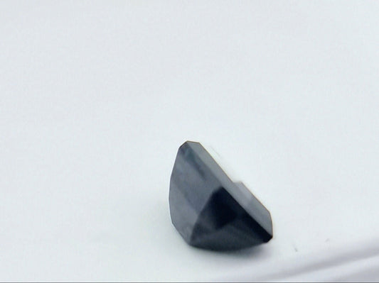 Side view of 1.84 ctw rectangular greenish blue sapphire showing its depth and precision cut, perfect for collectors and custom jewelry.