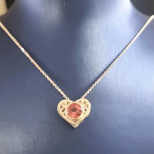 18K Pink Tourmaline Gold Heart Pendant worn on a model, showcasing its elegant design and sparkling gemstone for the jewelry category.