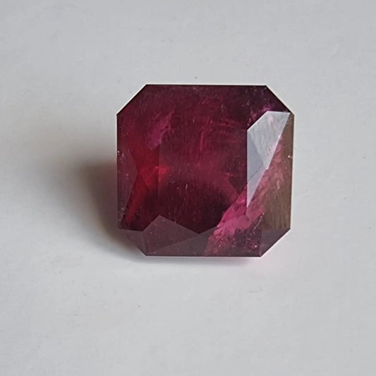 Square cut 13.16ct Rubellite Tourmaline loose gemstone with rich red tones, perfect for standout earrings or custom jewelry designs.