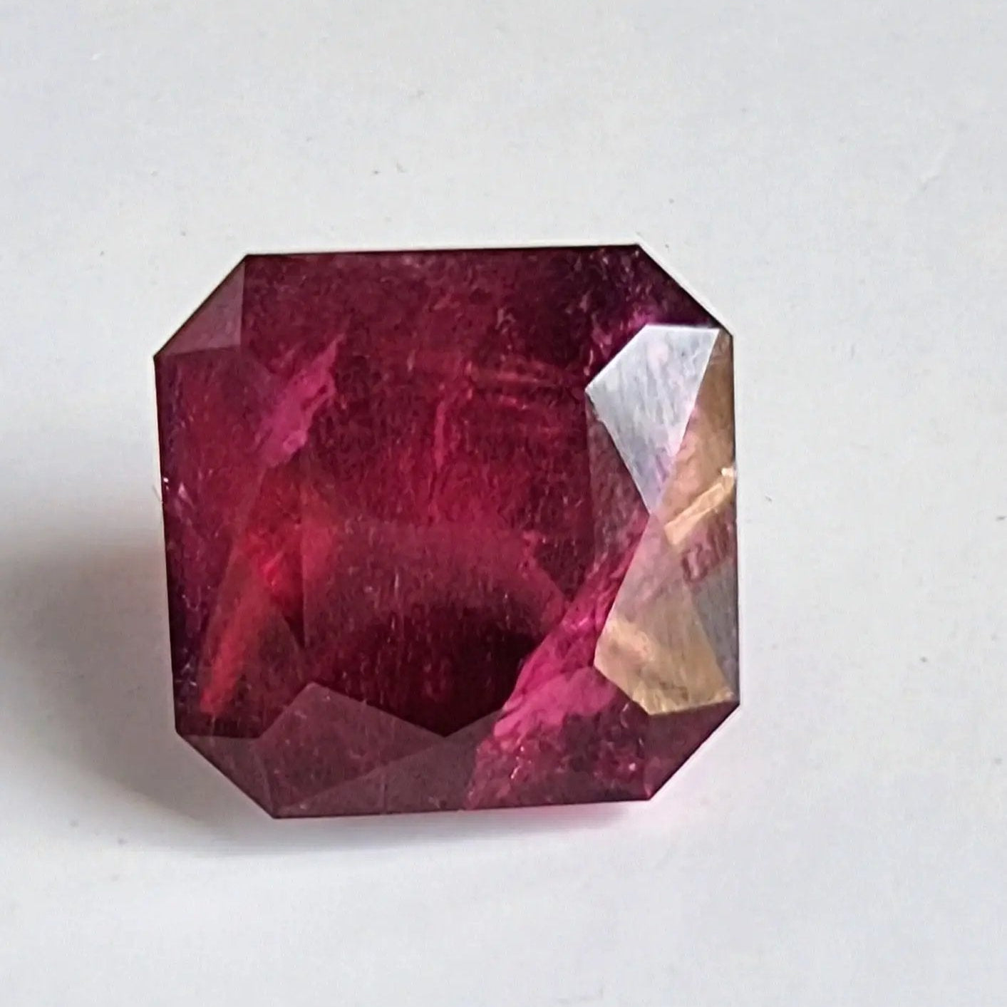 Vibrant 13.16ct square cut Rubellite gemstone with deep red color, ideal for collectors or high-end jewelry customization.