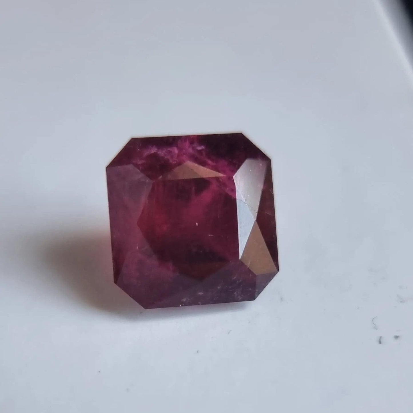 Deep red 13.16ct Rubellite Tourmaline gemstone in square cut, ideal for collectors or crafting unique gemstone jewelry.