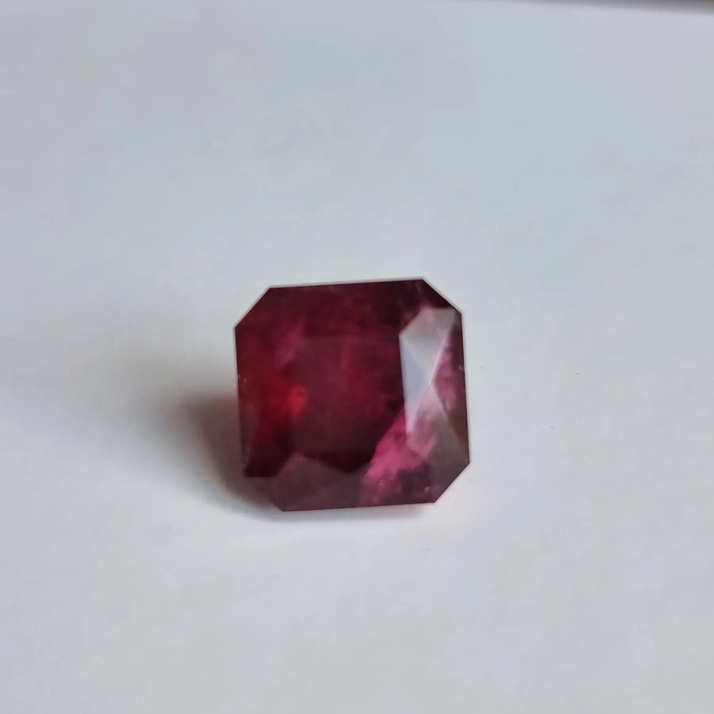 Elegant 13.16ct square cut Rubellite Tourmaline with dark red tones, perfect for standout rings or pendant designs.