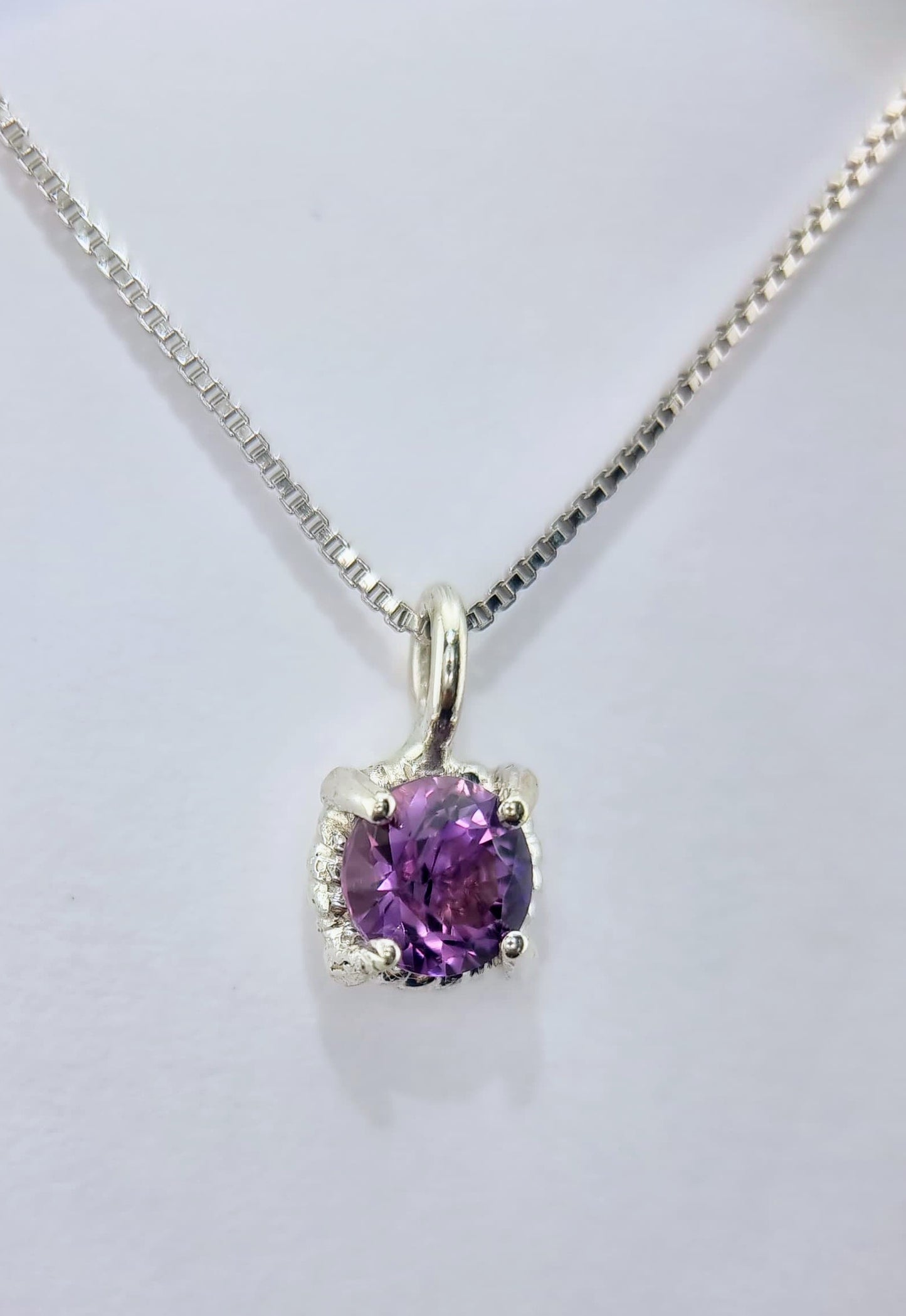 Sterling silver Amethyst Twist Pendant with a 6mm round gemstone on an Italian chain, perfect for daily wear and jewelry layering.