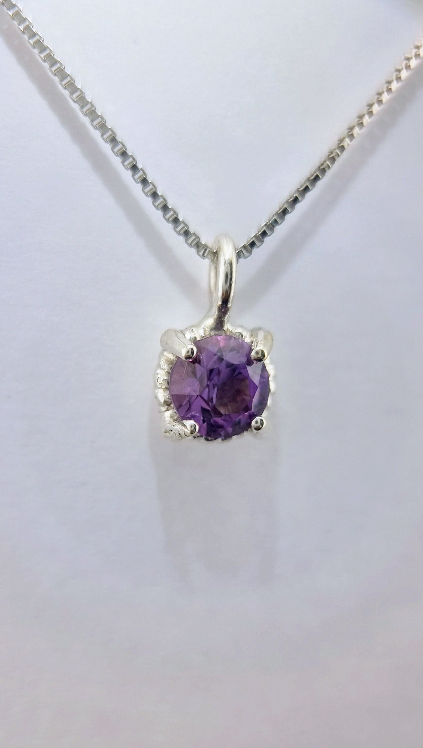 Amethyst Twist Pendant in Sterling Silver with a 6mm gemstone, displayed on an Italian chain for a timeless, feminine accessory.
