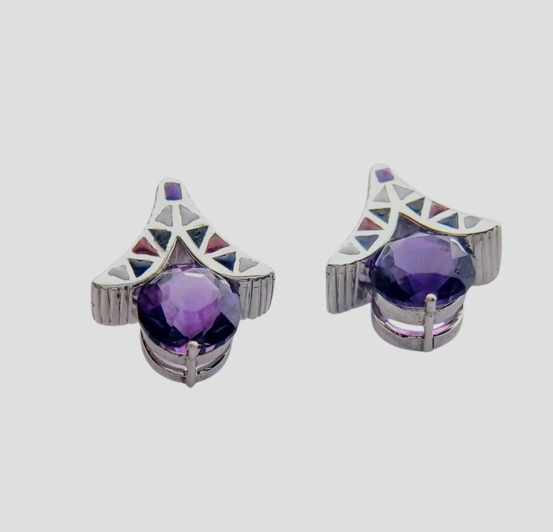 Angled view of handcrafted amethyst silver earrings with geometric resin inlay, showcasing the depth of the purple gemstones and detailed silverwork.