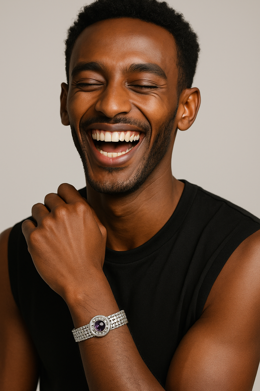 Model wearing Handmade Basotho Bracelet in Rhodium Plated Silver with amethyst stone, showcasing bold and elegant birthstone jewelry. Unique Jewelry - Hannaboya Jewelry.