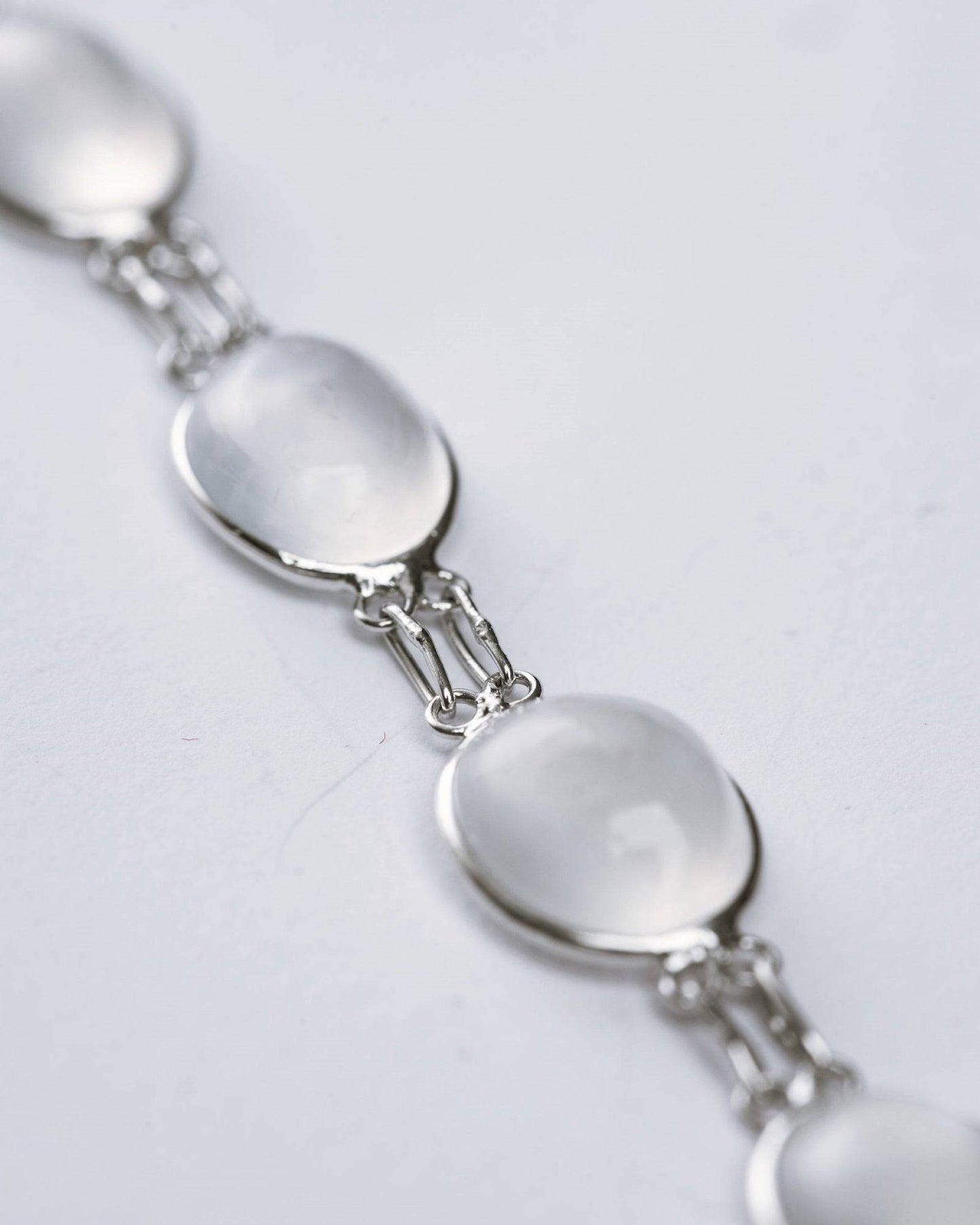 Close-up of the 13ctw moonstone bracelet highlighting its smooth cabochon gemstones and delicate silver link design.