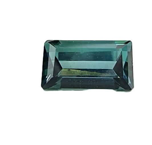 Stunning 1.20ct blue indicolite tourmaline gemstone in emerald cut, showcasing a rare teal-blue color with brilliant faceting and high transparency.