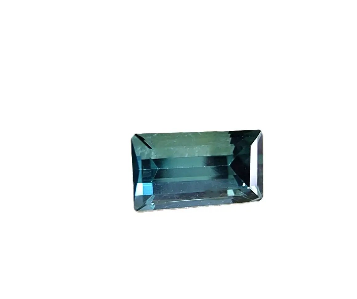 Rare 1.20ct blue indicolite tourmaline gemstone in emerald cut, offering exceptional clarity and a striking teal-blue color for collectors and designers.