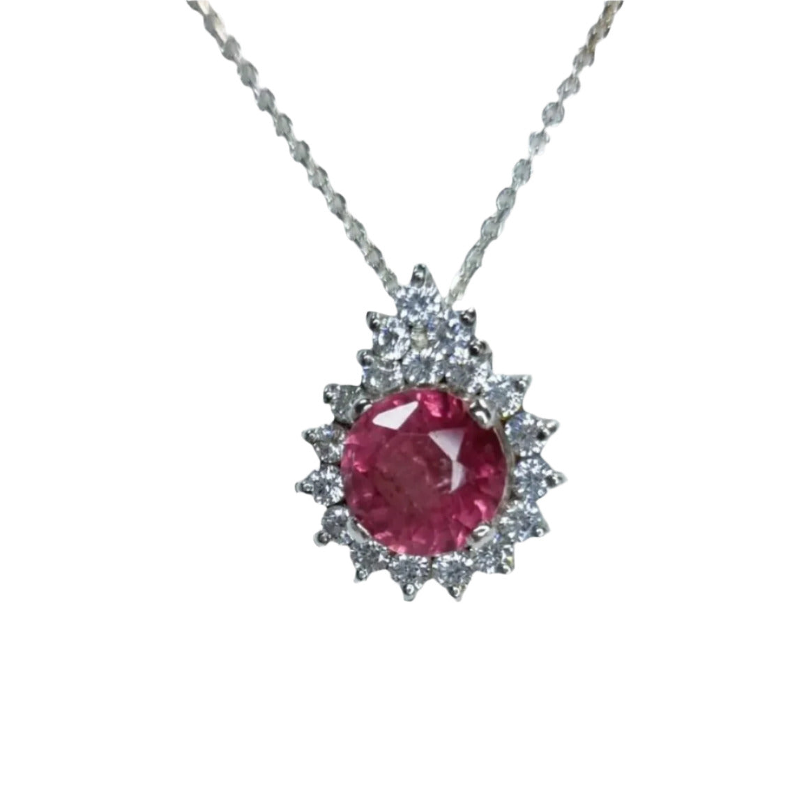 a necklace with a large pink stone in the center