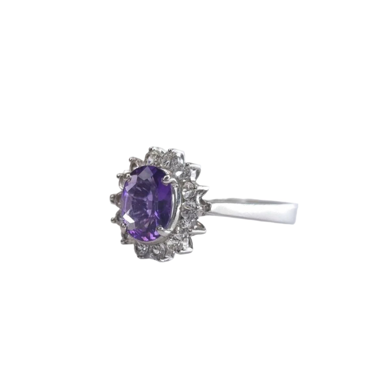Angled view of a 2.0ct oval purple amethyst and white zircon statement ring, featuring a stunning gemstone set in platinum-coated sterling silver.