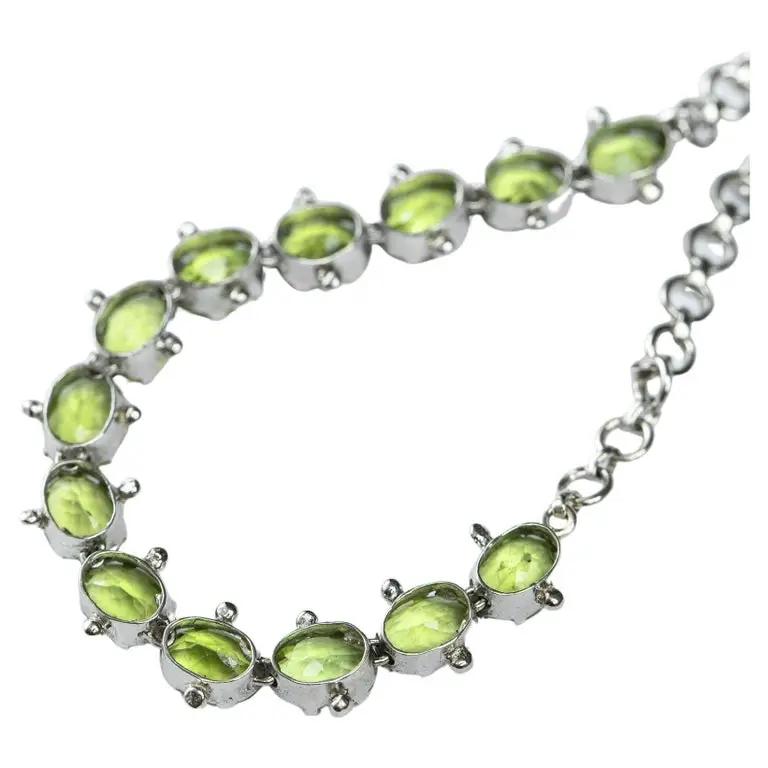 Back view of Mint Green Peridot Tennis Bracelet highlighting the sterling silver prong settings. A luxurious and timeless jewelry accessory.