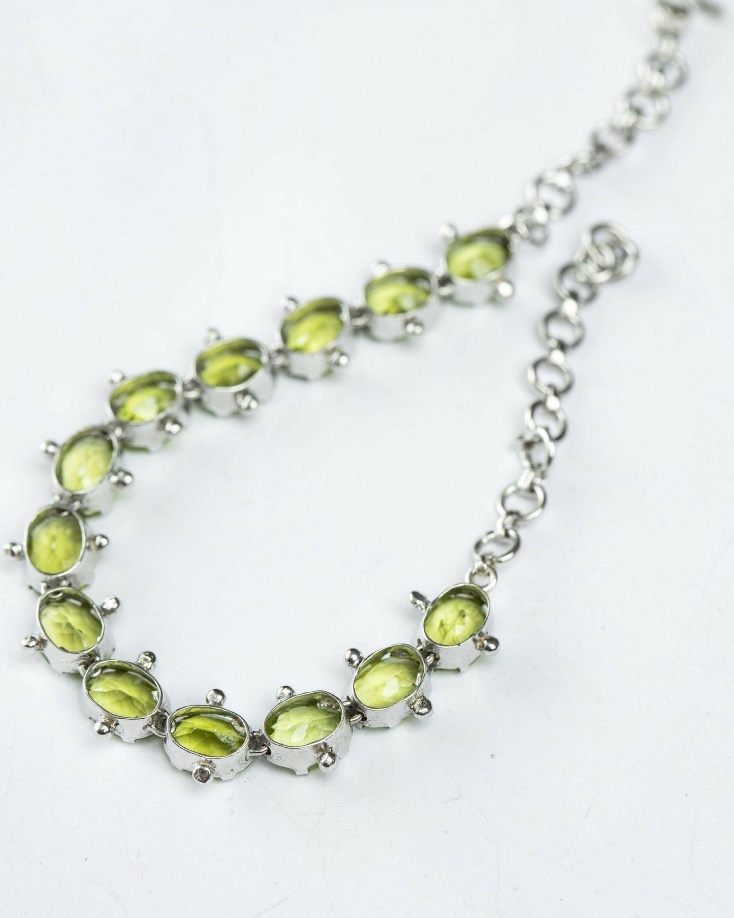 Elegant Mint Green Peridot Tennis Bracelet with adjustable sterling silver chain. A perfect blend of sophistication and style for any jewelry collection.