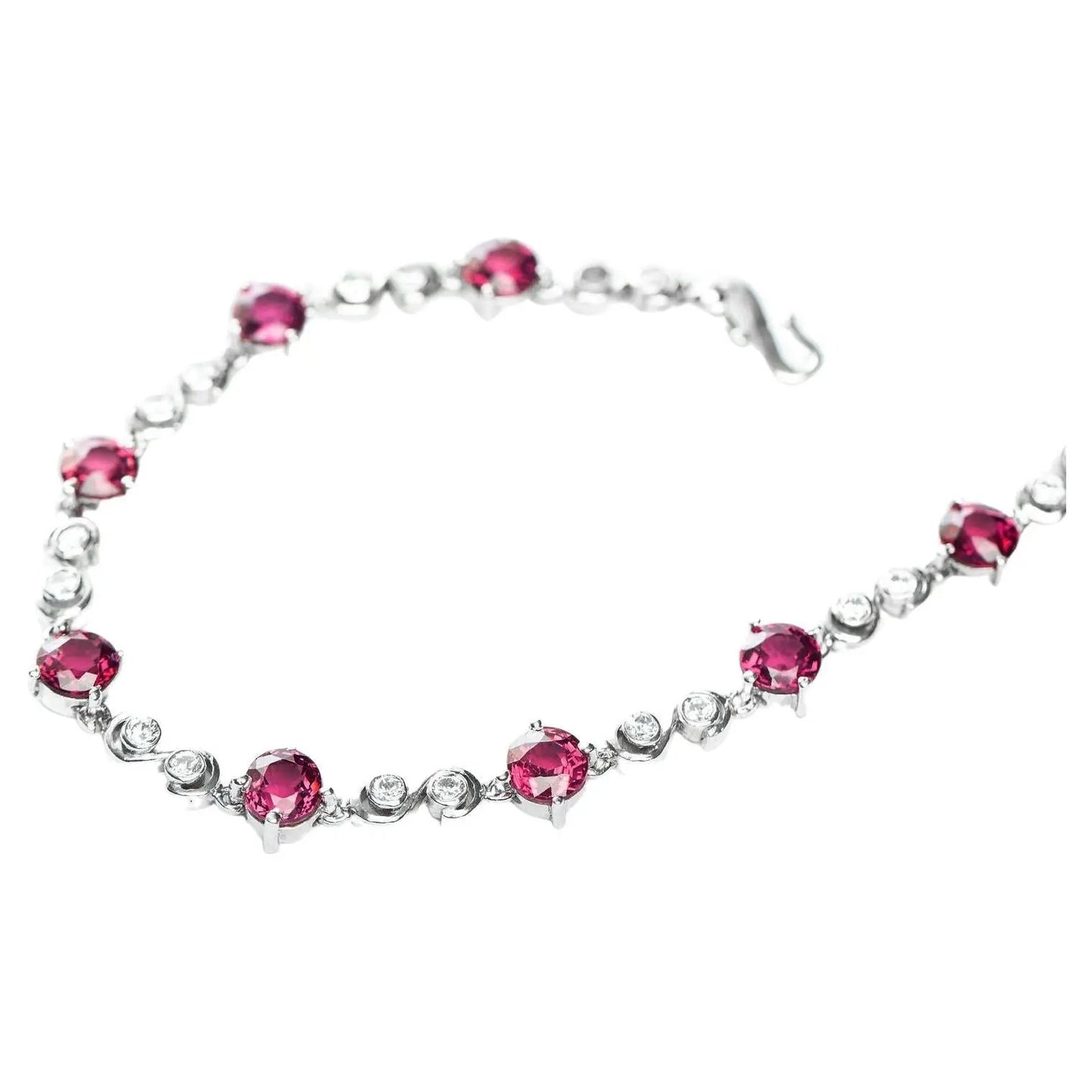 Stylish Pink Tourmaline Tennis Bracelet with alternating pink tourmaline and white zircon stones, secured with a classic hook clasp.