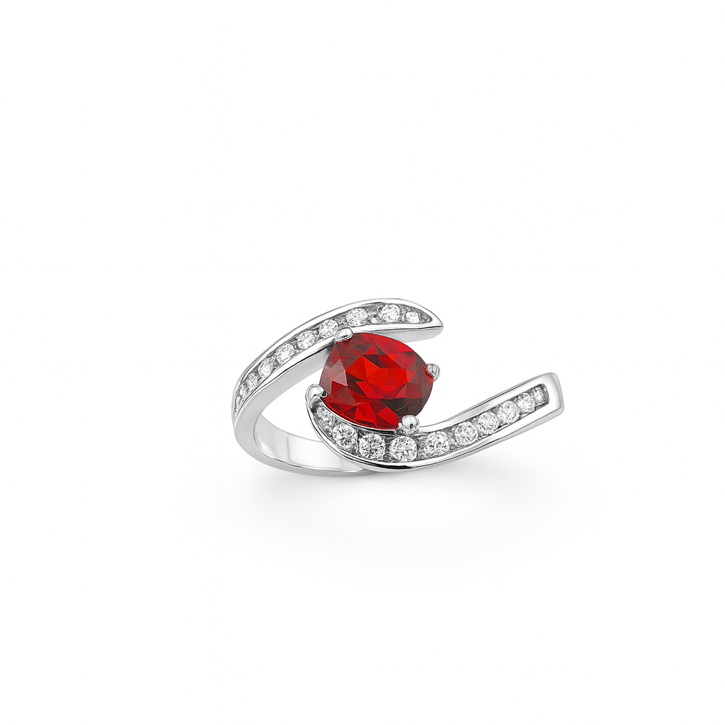 Silver ring with a natural red garnet gemstone on a white background