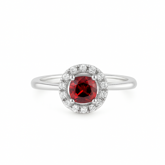 Ring with a natural red garnet gemstone and white natural zircon halo on a white background