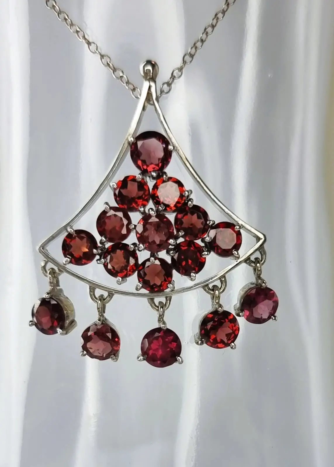 a necklace with a bunch of red stones hanging from it