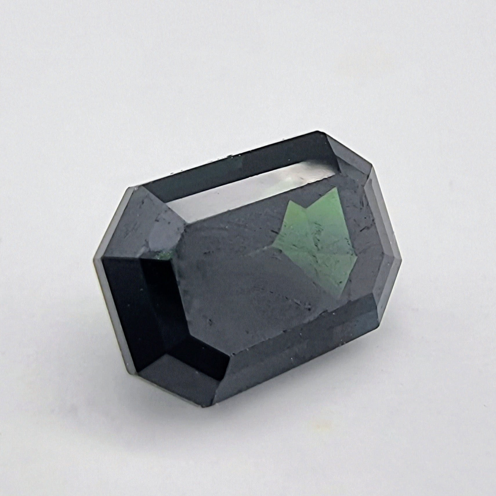 Greenish Blue Sapphire 1.84 ctw - Rectangular Cut gemstone with deep hues and sharp facets, ideal for fine jewelry or gemstone collections.