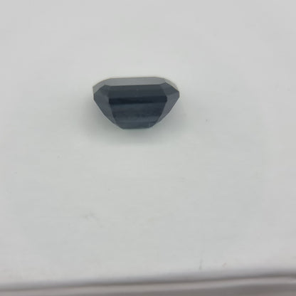 Back view of rectangular cut 1.84 ctw greenish blue sapphire, highlighting its polished facets and collectible gemstone quality.