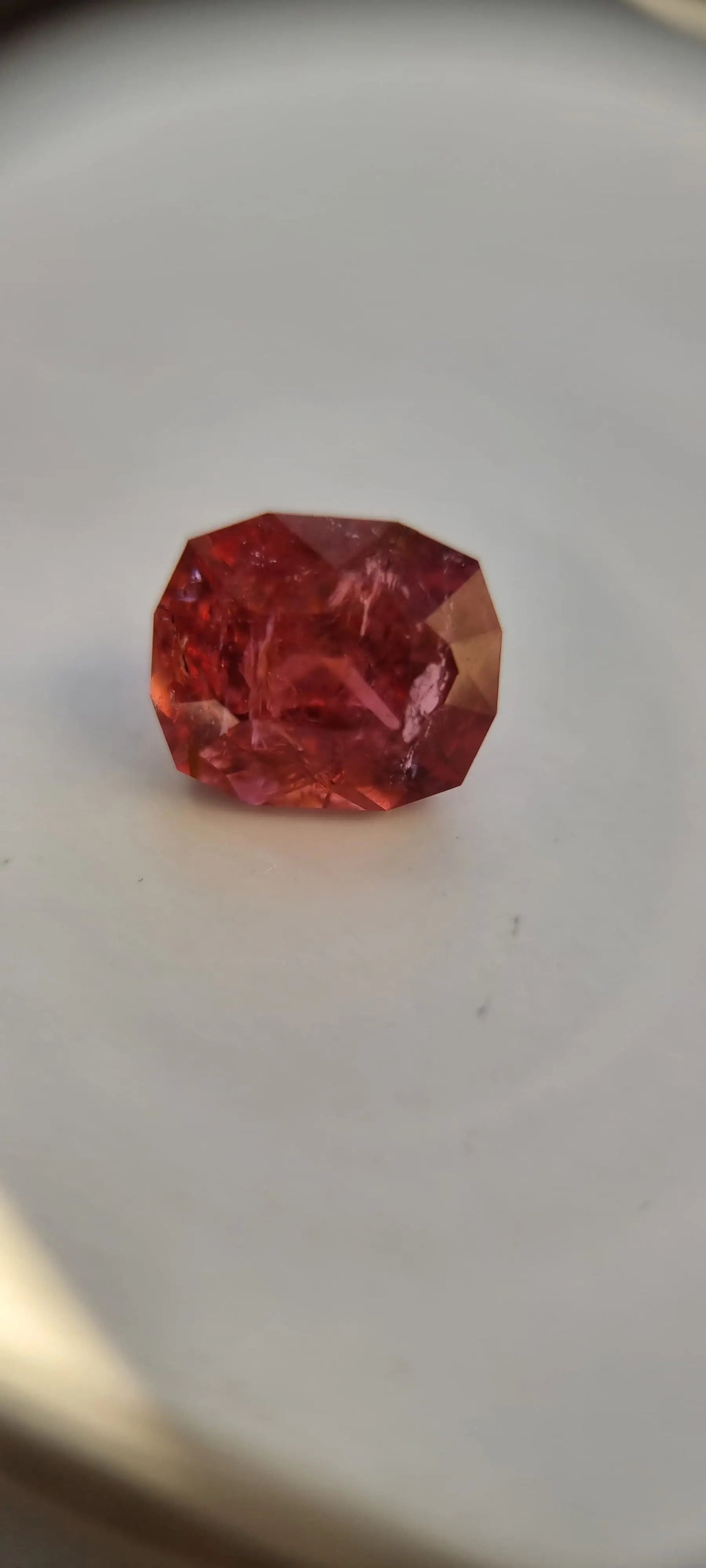 7.42ct Pink Tourmaline Gemstone with cushion cut and fiery pink-orange brilliance. A unique addition to any gemstone or jewelry collection.