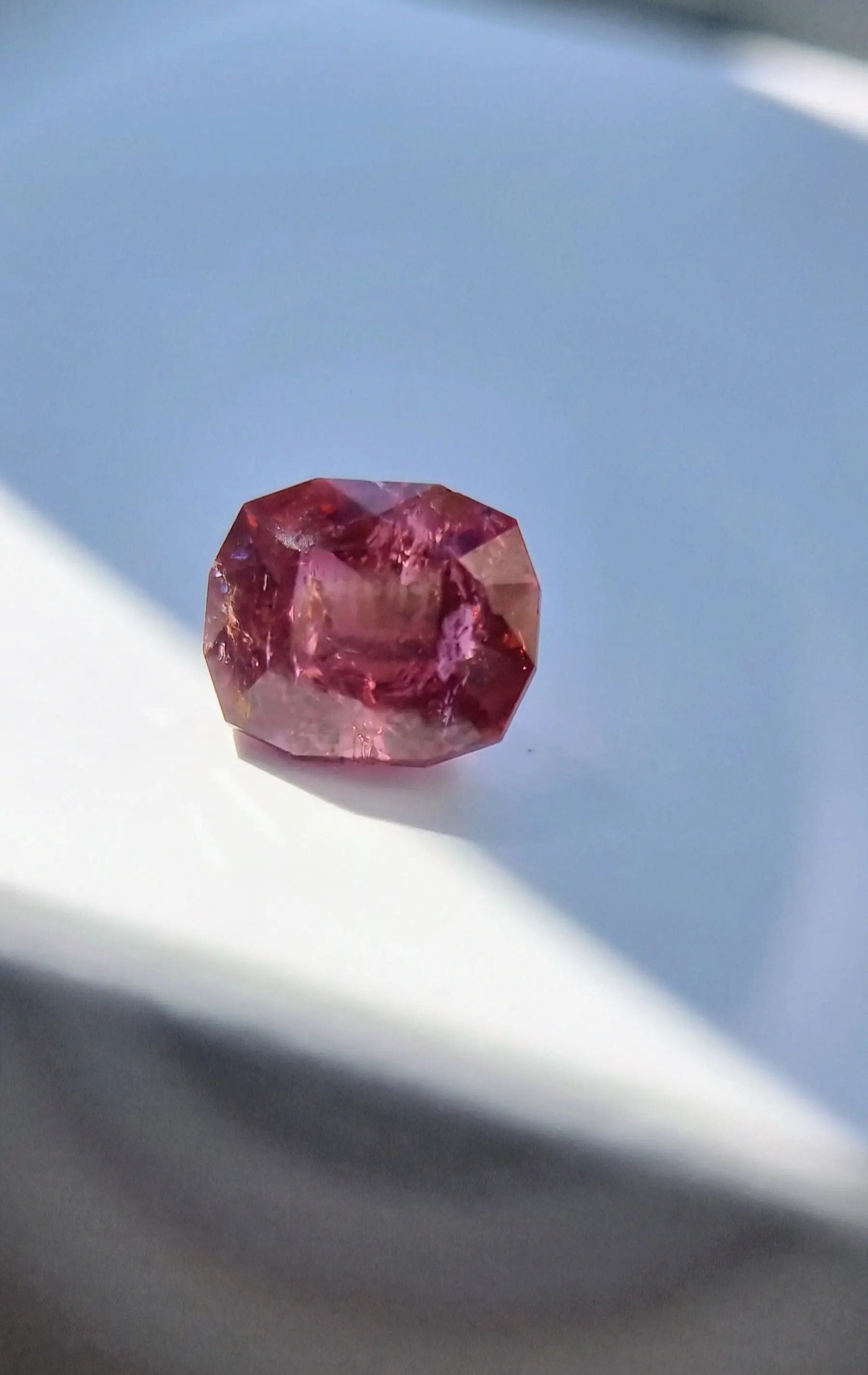 Radiant 7.42ct Pink Tourmaline Gemstone in cushion cut, reflecting light with deep pink hues. Ideal for high-end jewelry or gemstone gifts.