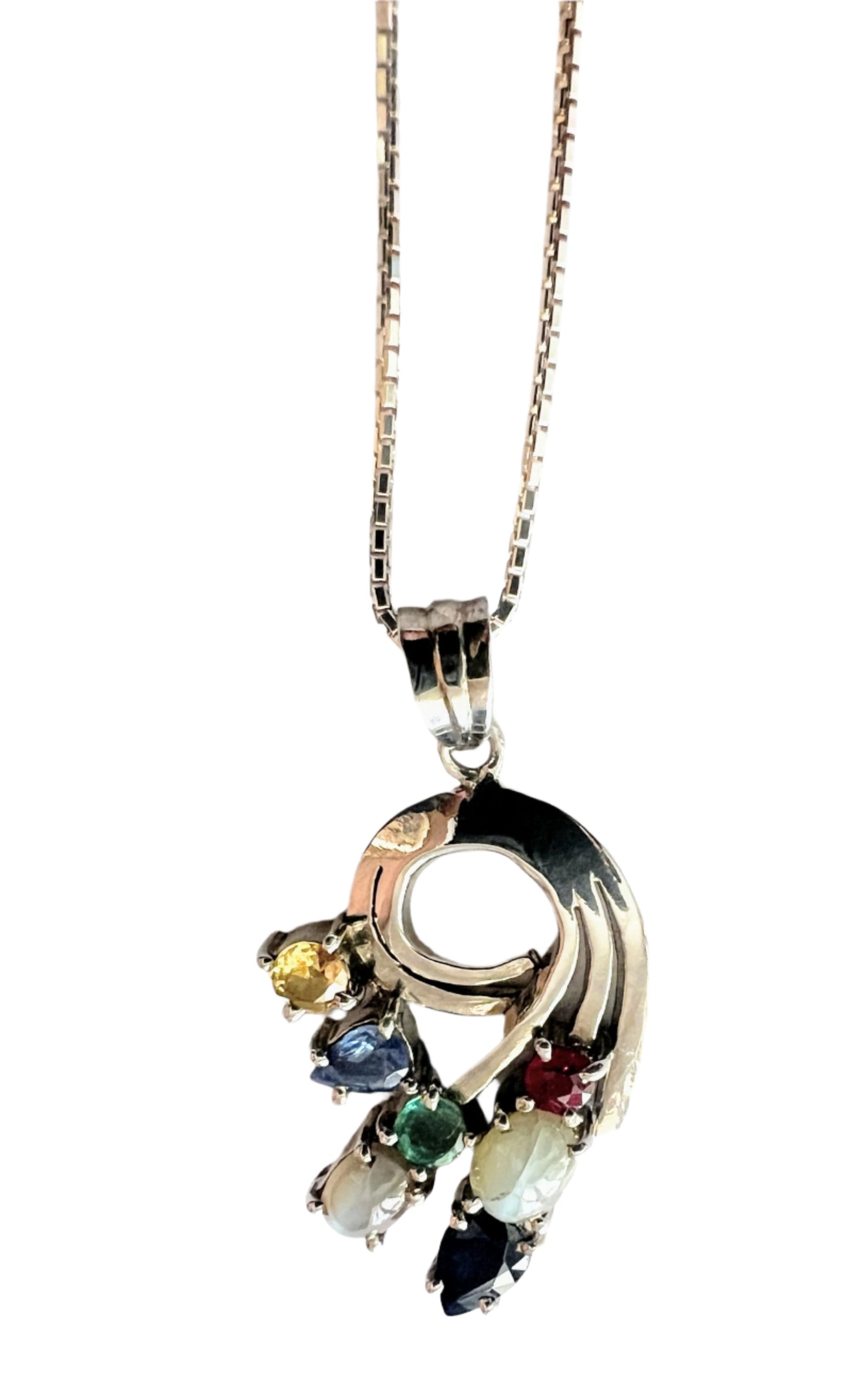 Luxury Multigem Swirling Infinity Pendant Necklace with floral motif, showcasing ruby, emerald, blue and pink sapphires, and cat's-eyes on a silver chain.