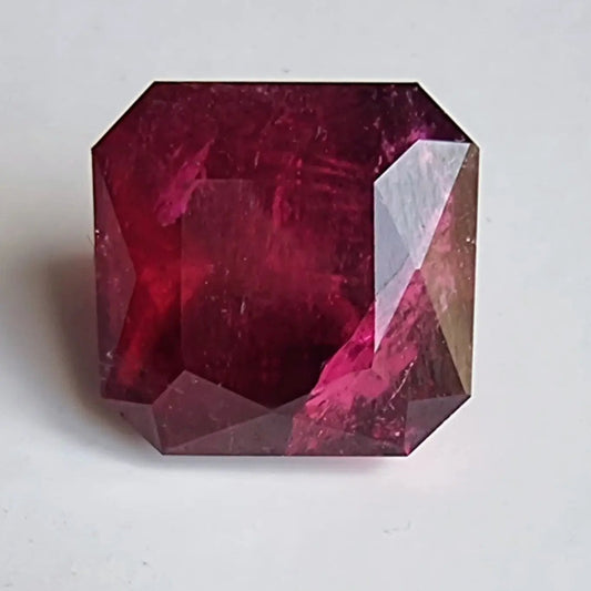 13.16ct Rubellite Gemstone in square cut showcasing deep red hues and clarity, ideal for bold jewelry settings like rings or pendants.