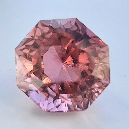 5.28ct octagonal natural pink tourmaline gemstone with vibrant clarity and unique faceting. Ideal for custom jewelry designs like rings or pendants.
