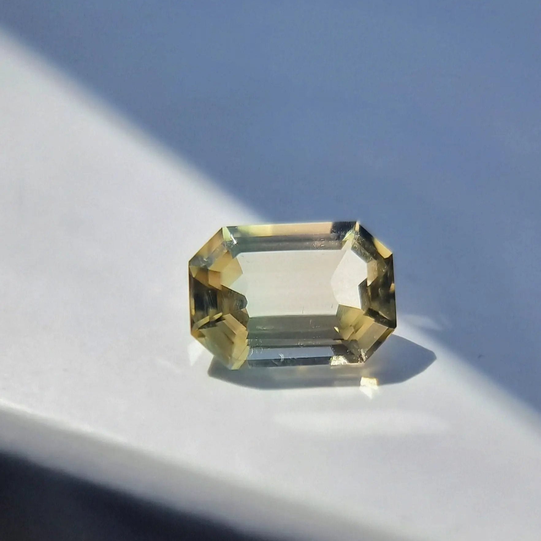 6.1ct emerald cut natural tourmaline gemstone with bi-color brilliance, ethically sourced and ready for custom settings.