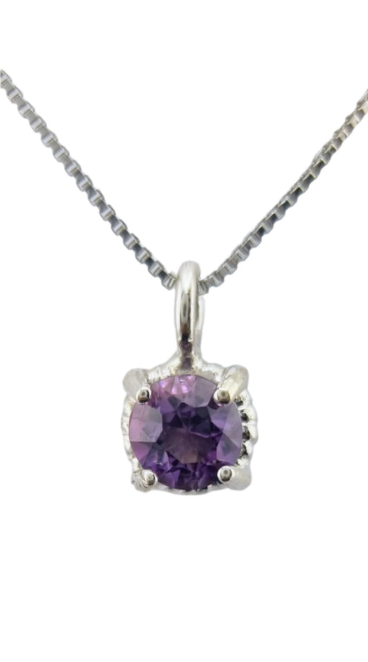 Amethyst Twist Pendant in Sterling Silver featuring a 6mm round purple gemstone on a sleek Italian chain, ideal for elegant layering.