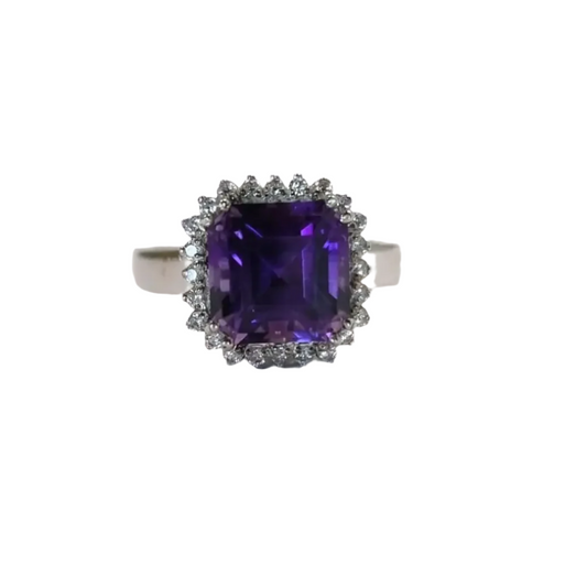 a ring with an amethorate surrounded by diamonds
