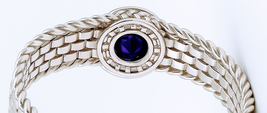 Close-up of Handmade Basotho Bracelet in Rhodium Plated Silver with deep purple amethyst set in a detailed silver bezel. Unique Jewelry - Hannaboya Jewelry.