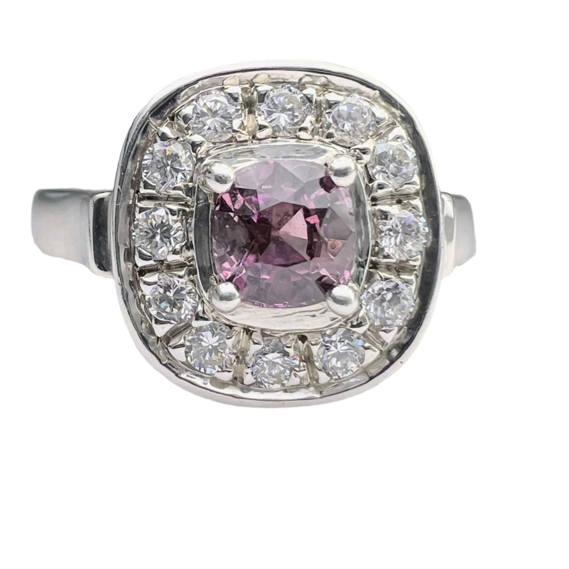 Unique jewelry piece featuring a 1ct cushion pink sapphire ring with a halo of white gemstones in platinum silver setting. Ideal for elegant occasions.