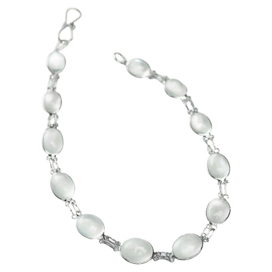 Stylish moonstone link bracelet featuring 13ctw cabochon gemstones set in silver. A timeless white bracelet for a sophisticated look.