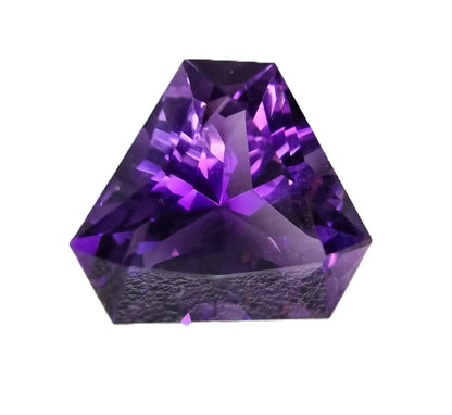 Faceted 12.7ct triangular cut amethyst gemstone with a striking purple glow. Ideal for jewelry designers and gemstone enthusiasts.
