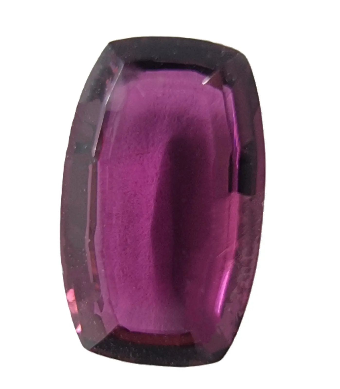 Close-up of a 2.6ct oval pinkish red rubellite tourmaline gemstone, emphasizing its deep pink tones and precision cut for fine jewelry settings.