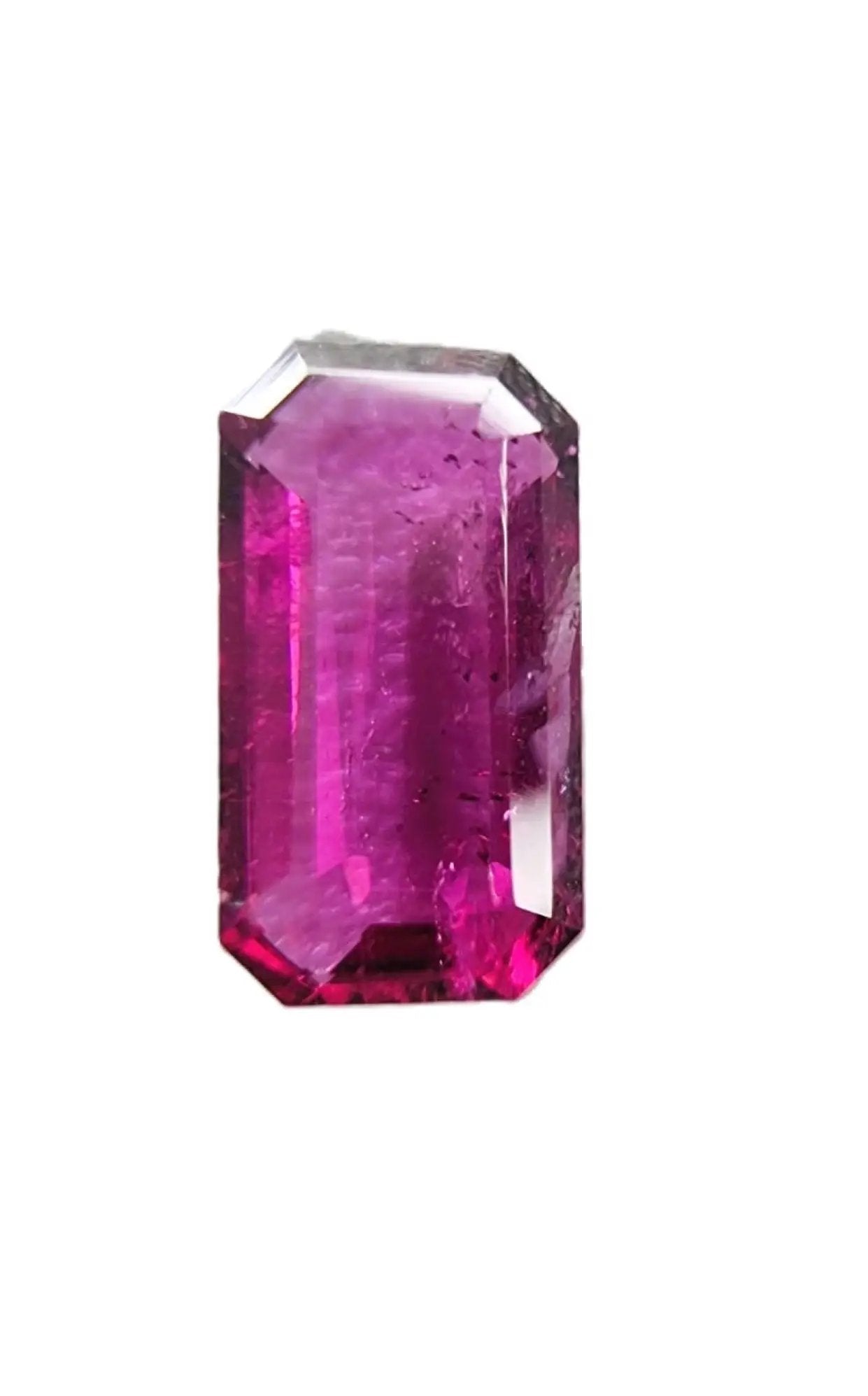 High-quality 3.02ct emerald cut red rubellite tourmaline gemstone with a rich pinkish-red tone, perfect for custom jewelry settings.