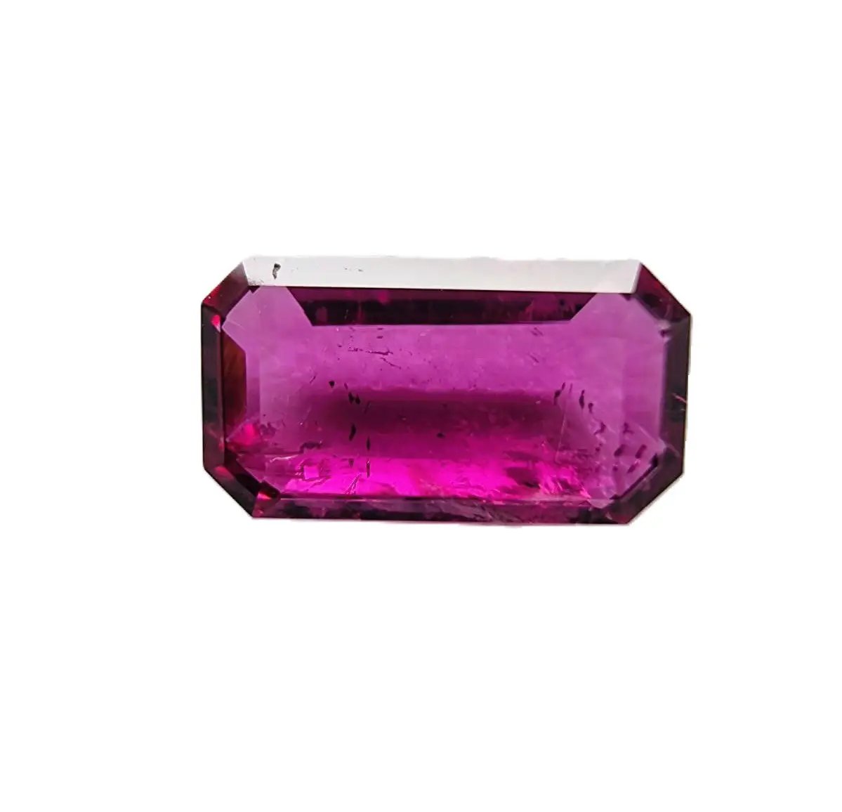 Stunning 3.02ct emerald cut red rubellite tourmaline gemstone with sharp facets, ideal for creating elegant rings or pendants.