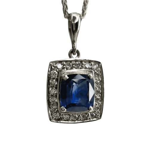 a pendant with a blue stone surrounded by diamonds