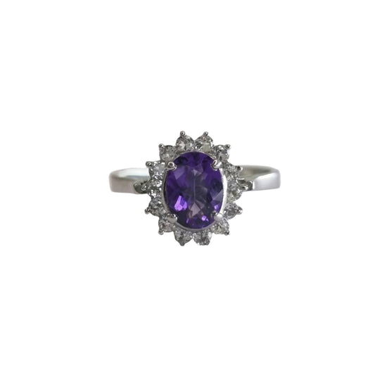 Front-facing view of a 2.0ct oval purple amethyst and white zircon ring, showcasing its brilliant sparkle and intricate halo design.