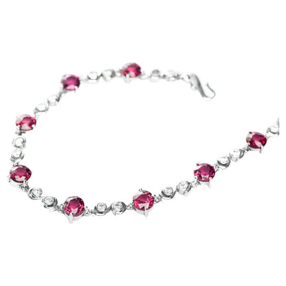 Stylish Pink Tourmaline Tennis Bracelet with alternating pink tourmaline and white zircon stones, secured with a classic hook clasp.